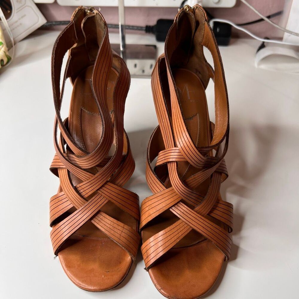 Diane von Furstenberg gladiator wedge sandals featuring crossover straps and a g